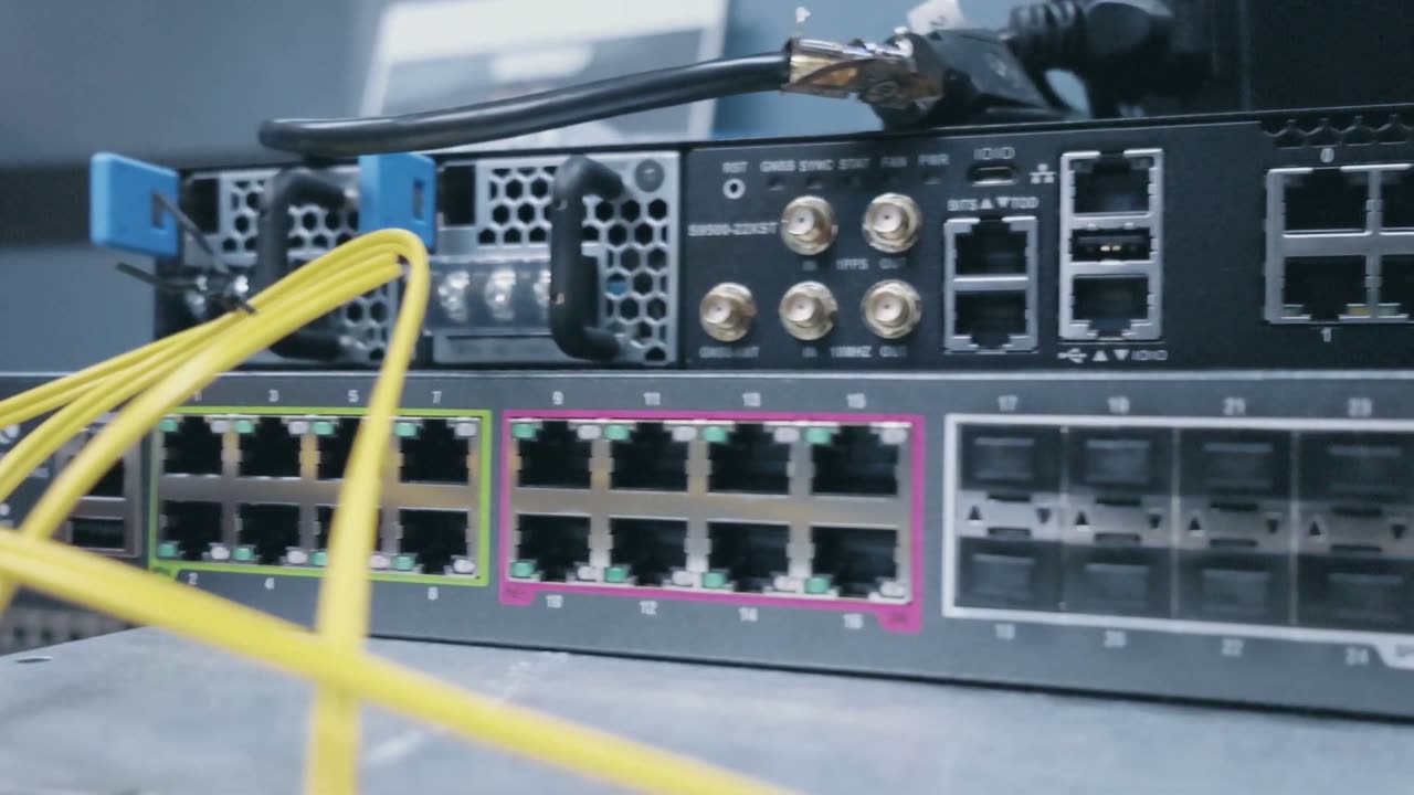 Fiber patch cables running into a network switch